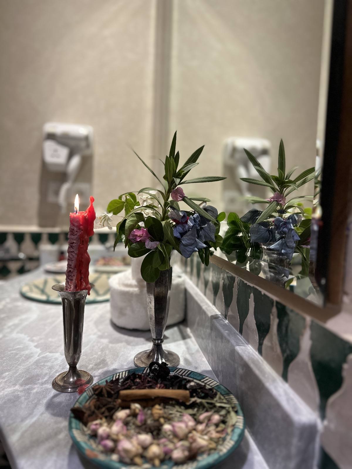 Candle and fresh flowers prepared at Riad Mazar Fes